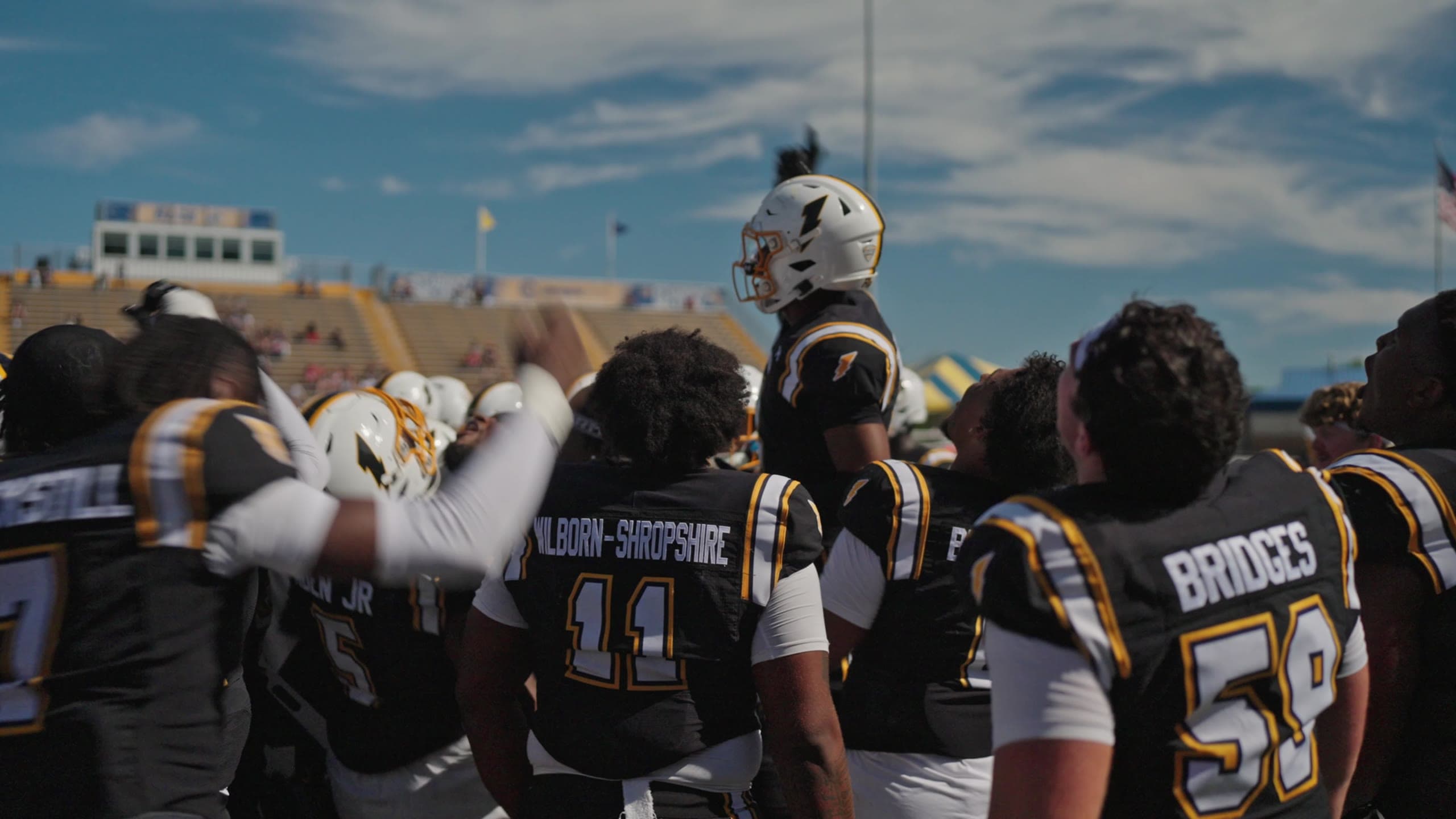 Football team gathered on the sideline